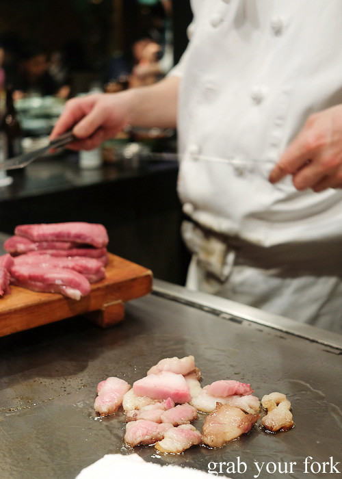 Kobe wagyu beef sirloin fat sizzling on the teppanyaki at Wakkoqu, Kobe, Japan