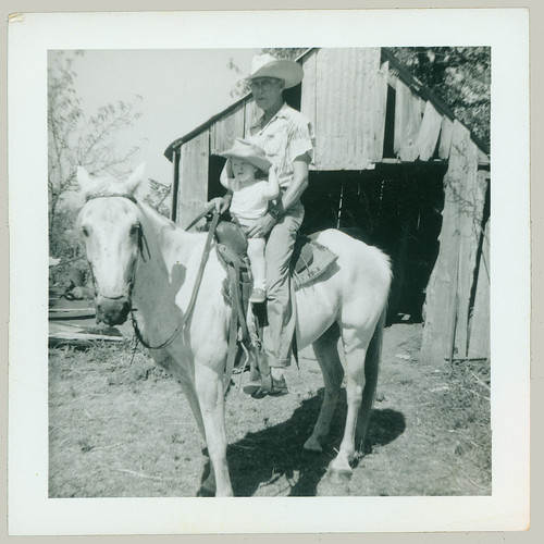 Boy and grandpa on a horse
