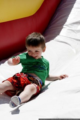 boy at the bottom of the huge inflatable slide    MG… 