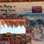 Sign with dugongs in a tour selling booth in Port Vila