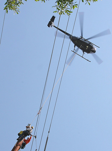 men 20d northerncalifornia canon photo wire line pole helicopter photograph precision sacramento workingmen towerworkers copyrightedmaterialallrightsreserved copyrightedallrightsreserved familygetty2010 familygetty