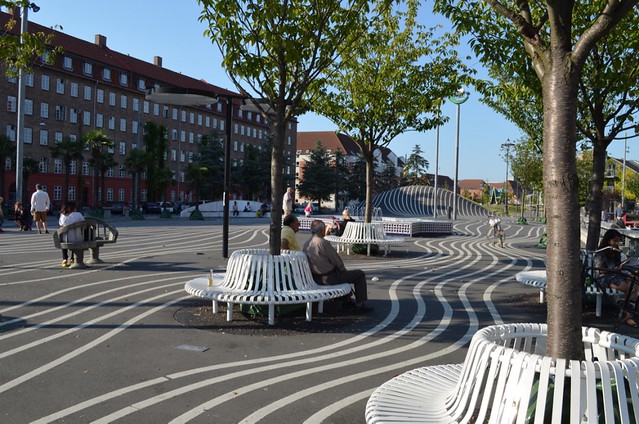 Superkilen park the black square lines and Belgian benches around cherry trees Copenhagen