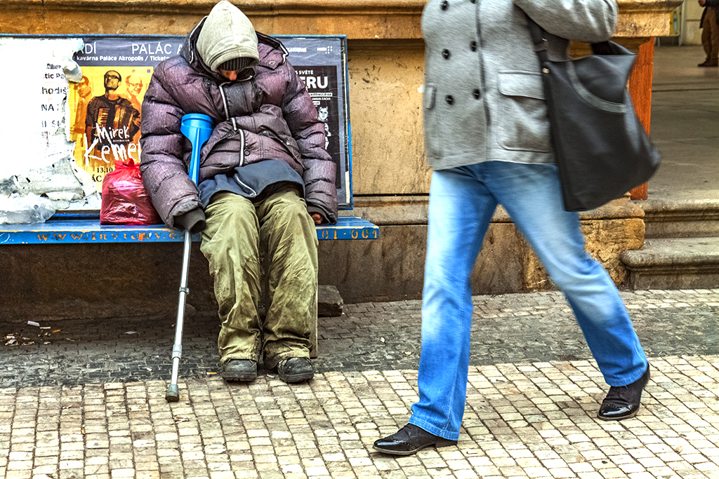 Homeless man outside the Masaryk commuter rail station--Prague