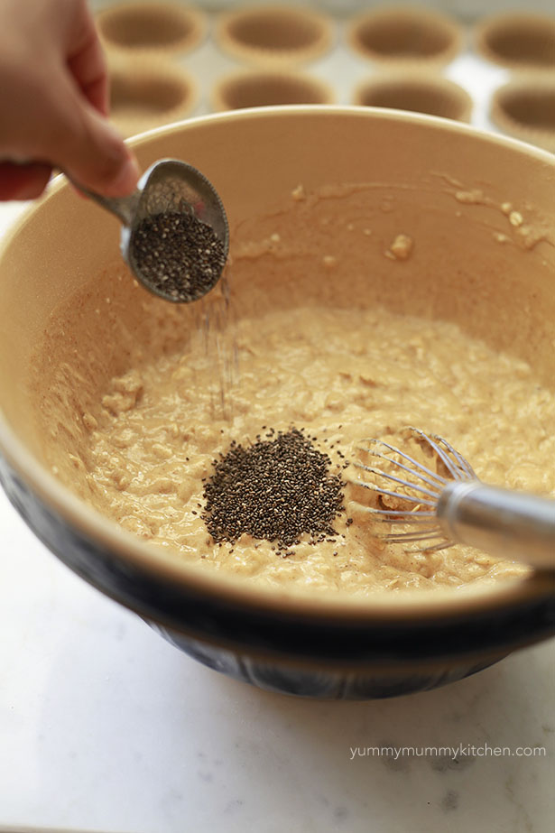 A bowl of oatmeal muffin batter with chia seeds added in. 