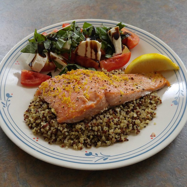 Salmon with lemon zest on quinoa cooked in clam juice, caprese with tomatoes from my mother-in-law's garden. I made it for both of us, but only one plate was pretty.