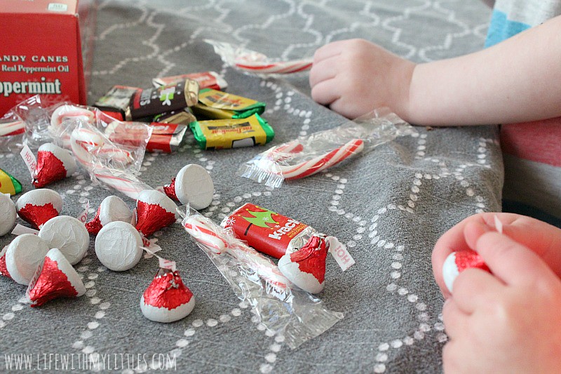 These easy candy Santa Hat Sleighs are perfect for neighbor gifts, teachers, or anyone! And they are so easy that little kids can help! What a simple DIY Christmas craft for kids!