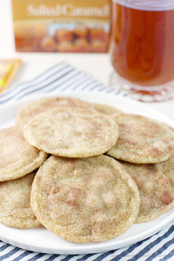 Caramel-Studded Snickerdoodles on a plate with a cup of tea.