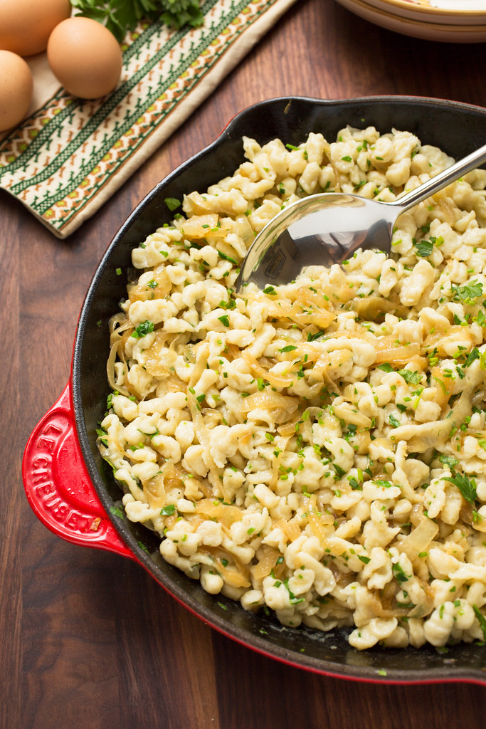 Spaetzle tossed in pan with onions and herbs