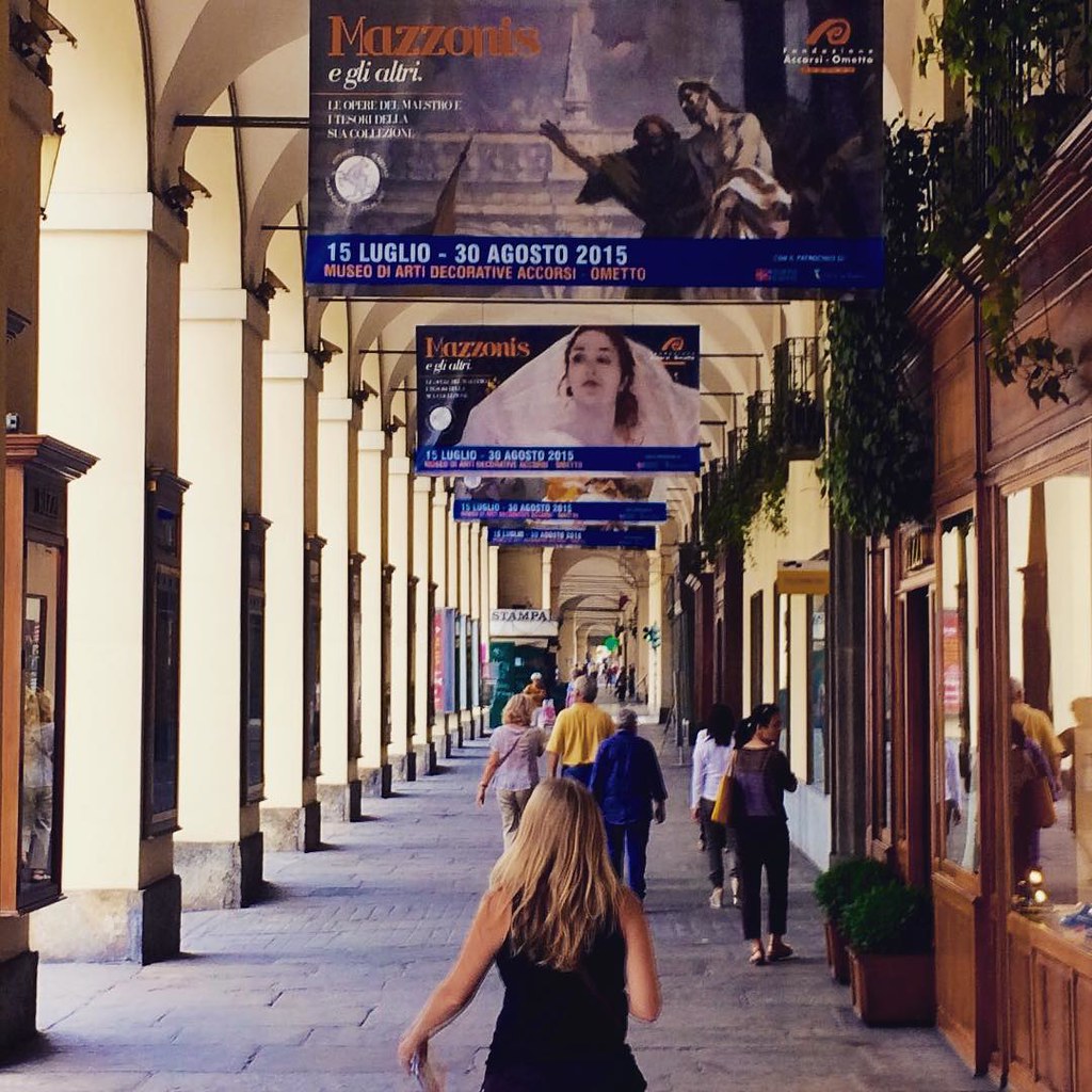 Porticos of Torino. Covered walkway a ingenious town planning initiative which not only makes the city beautiful it also increases floor space above and provides advertising space in the columns. #travel #upsticksngo #instatraveller #porticos #italy #trav
