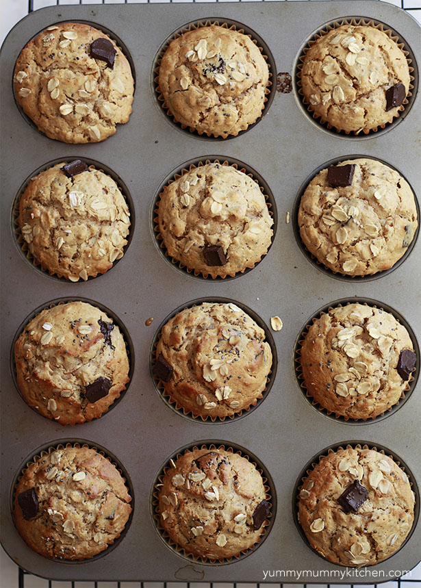 A muffin tin filled with freshly baked peanut butter oatmeal muffins. 