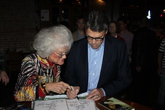 Rick Perry signs autographs
