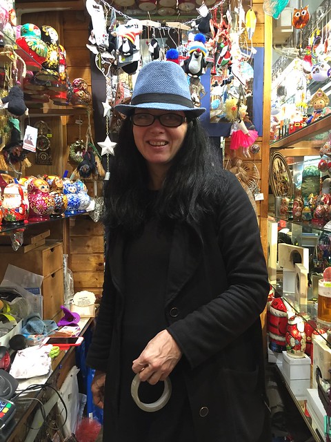 She's the store owner, souvenir shop