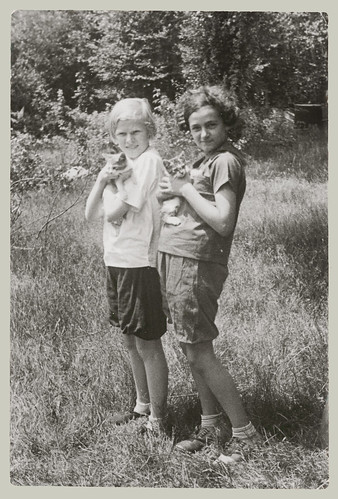 Two children with kittens