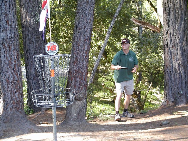 Disc golfer shoots for the basket. Photo used with permission through creative commons, https://www.flickr.com/photos/steveganz/.