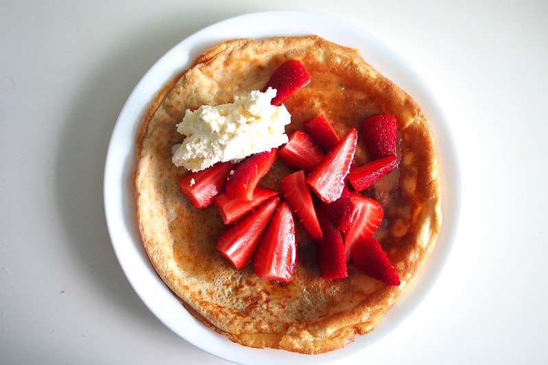 crepe with whipped cream and fresh strawberries