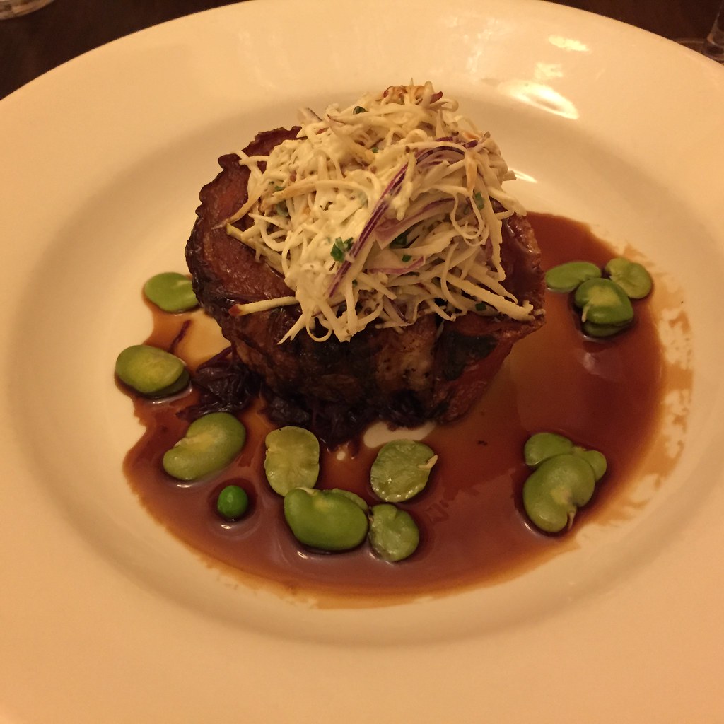 rolled pork belly with coleslaw, broad beans, peas and a red wine jus from 1918 in tanunda