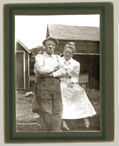 Couple in front of the house