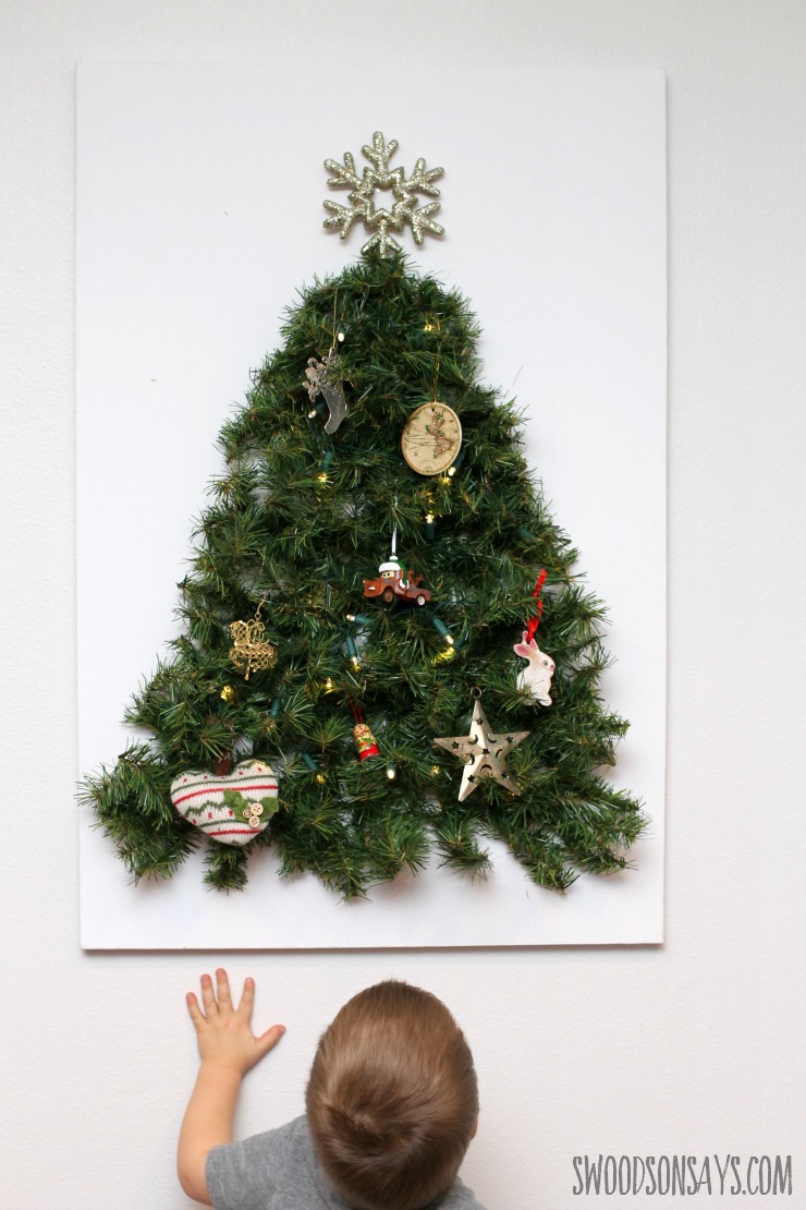 DIY Toddler Proof Tutorial - keep your fun ornaments as decoration instead of toys with this easy tutorial for a wall tree that is baby proofed! Swoodsonsays.com