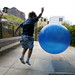 boy bouncing a big blue ball    MG 6996