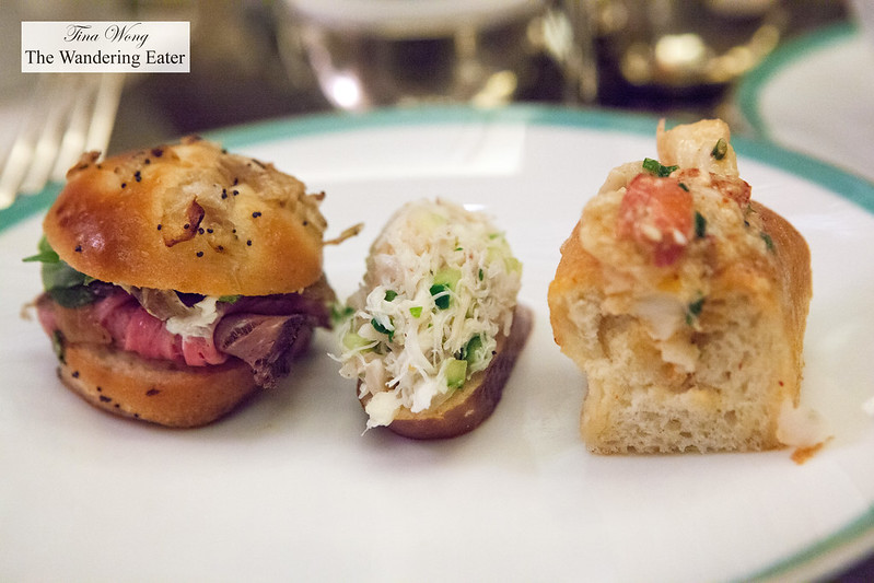Left to Right: Thyme roasted prime rib sandwich, Peekytoe crab salad crostini, and lobster roll with daikon sprouts in buttered brioche roll