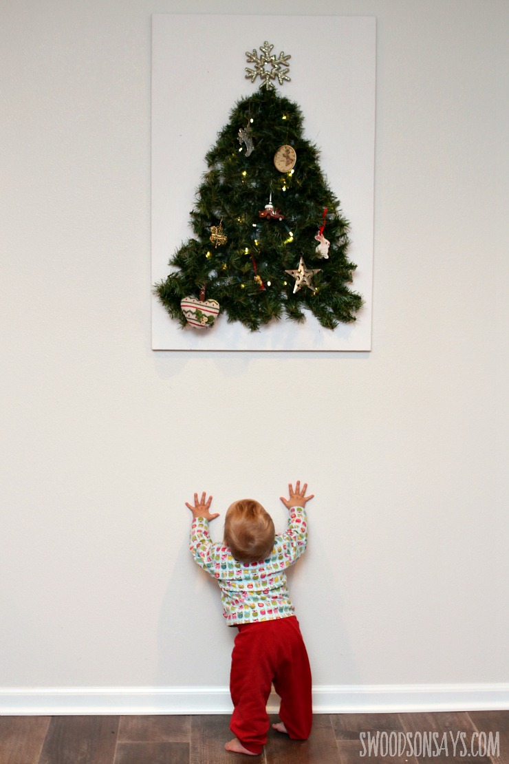 DIY Toddler Proof Tutorial - keep your fun ornaments as decoration instead of toys with this easy tutorial for a wall tree that is baby proofed! Swoodsonsays.com