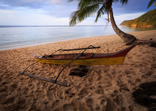 ocean sunset seascape beach water sand philippines palm canoe remote coconuttree whitesand banka surigaodelsur panaraga