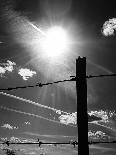 sky blackandwhite bw sun oklahoma clouds fence skyscape landscape wire post sharp cumulus barbedwire rays poles streaks sunrays barbed skiatook