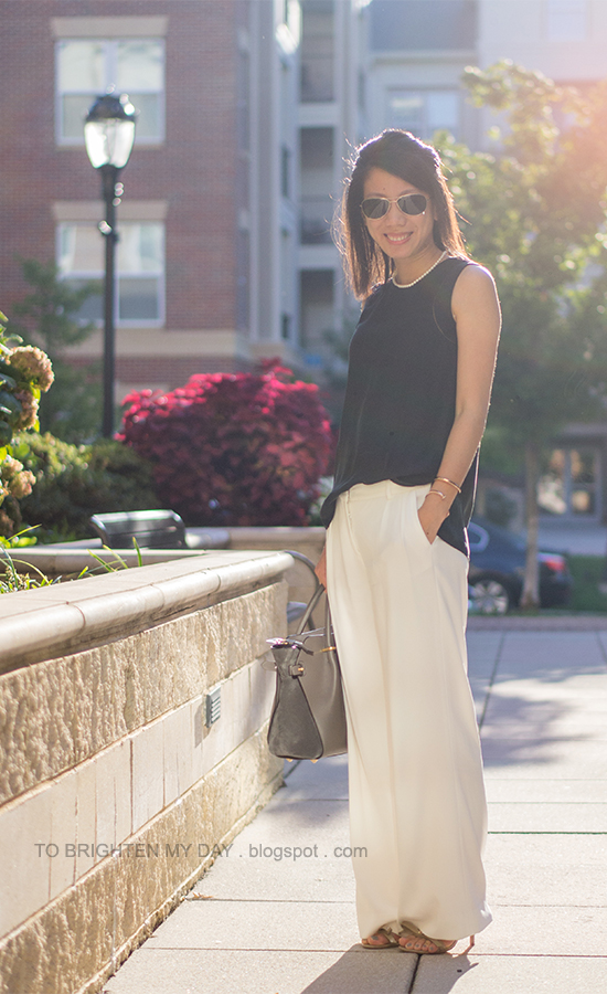 pearl necklace, black silk top, rose gold jewelry, white trousers, bow sandals