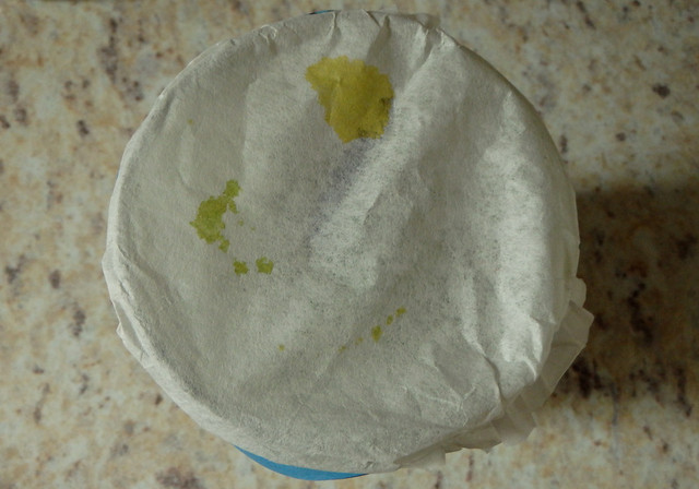 jar with a coffee filter over the top, with yellow stains