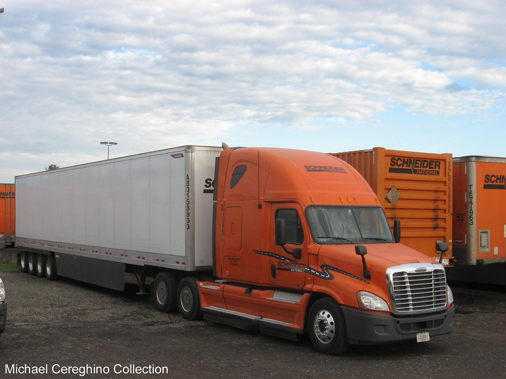 Schneider National Freightliner Cascadia with 4 axle heavy haul trailer