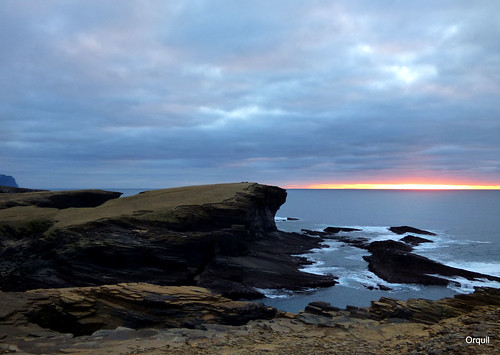 yesnaby sea cliffs scenery february winter sunset broughofbigging headland noustofbigging inlet rocky shoreline dark hard basalt rockformations silhouette profile spectacular seaside seascape northatlantic ocean coastline surprisingly calm white surf colourful suset band horizon many clouds cloudscape popular attraction visitorcentre maintained walkways orkney islands scotland uk unitedkingdom greatbritain orcades dramatic attractive interesting memorable westmainland lateafternoon