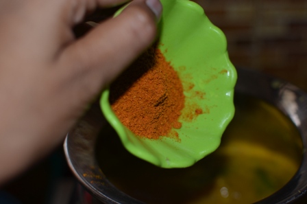 Adding sambar powder