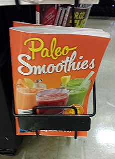 Paleo Smoothies recipe book, supermarket checkout line.