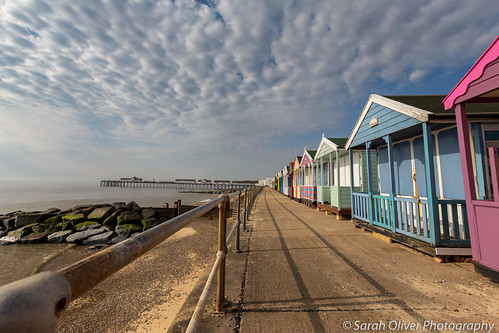 southwold suffolk unitedkingdom gb uk beach huts sky clouds pier railings canon 6d outside landscape shadow pastel colour