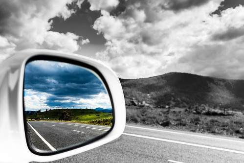 road reflection mirror cloudy rearview roadside carwindow snowymountains rearmirror