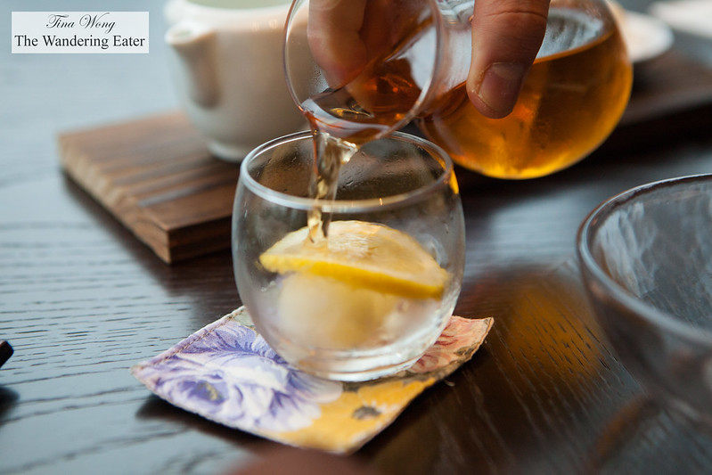 Pouring the non-alcoholic apertif of honey lemon iced tea
