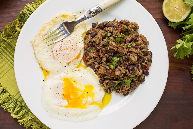 gallo pinto on plate with fried eggs