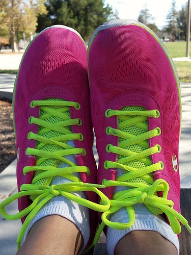Neon pink running shoes.