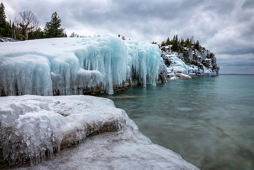 bruce peninsula national park ontario canada ice snow water winter clouds trees landscape outdoor icicle