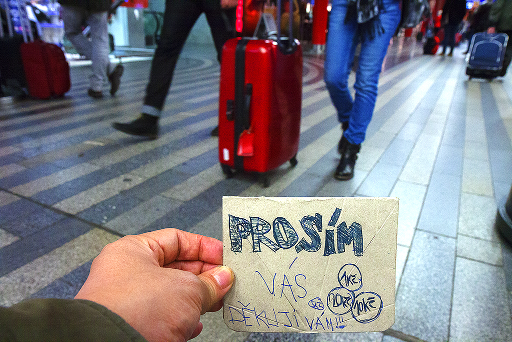 Begging sign bought from man on bench outside main train station--Prague