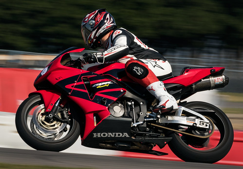 red oklahoma speed honda movement action outdoor helmet racing motorcycle panning motorracing racer
