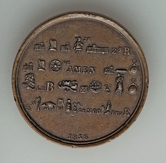 Bronze rebus medal reverse