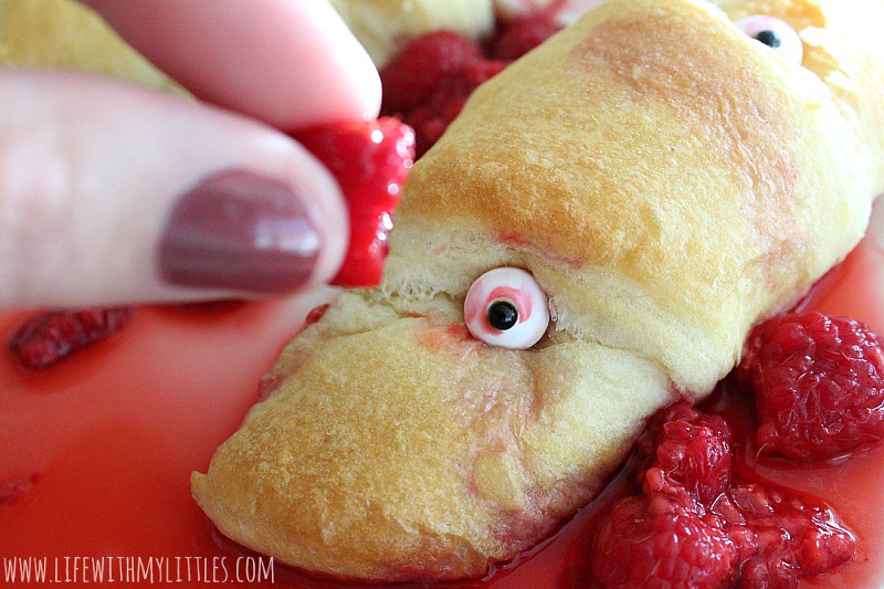 These simple raspberry monster rolls are the perfect side or dessert for your spooky Halloween dinner! And they are so easy!