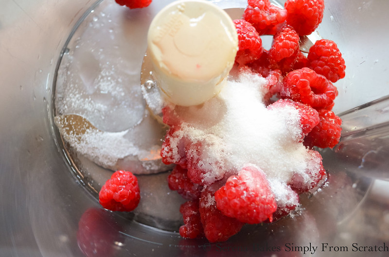 Tall-And-Creamy-Cheesecake-With-Raspberry-Swirl-Raspberries-Sugar.jpg