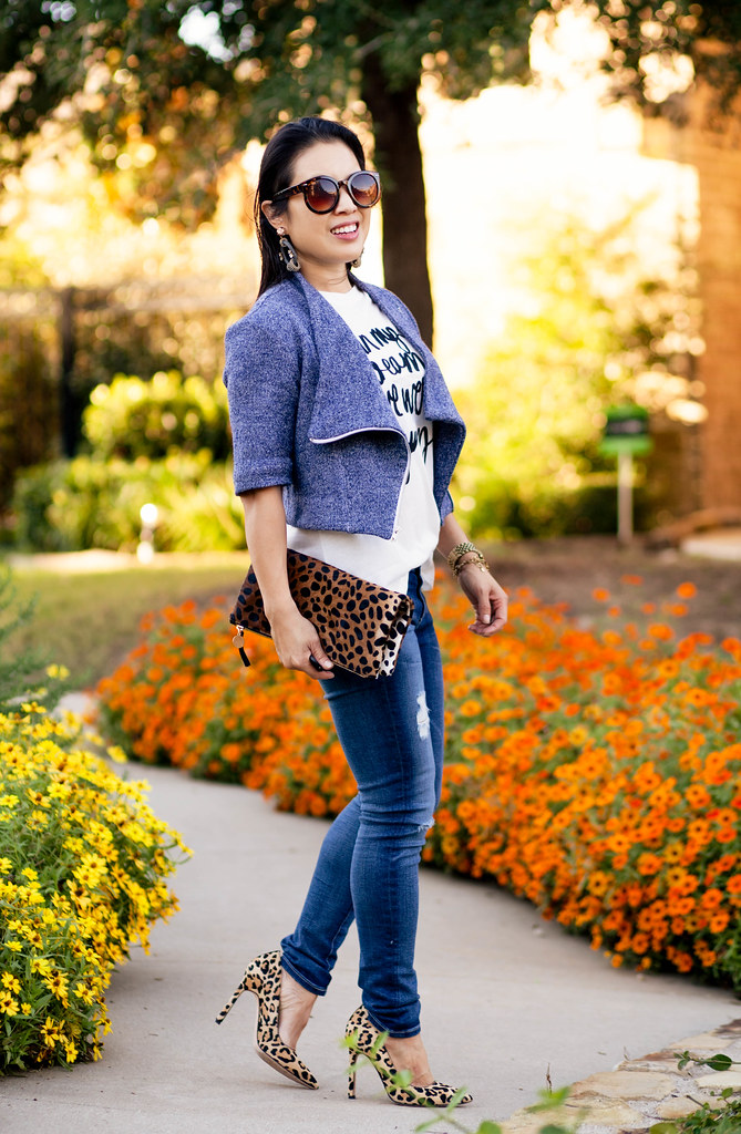 cute & little blog | petite fashion | jean kaori blue knit moto jacket, graphic tee, distressed jeans, leopard pumps, leopard clutch | fall outfit