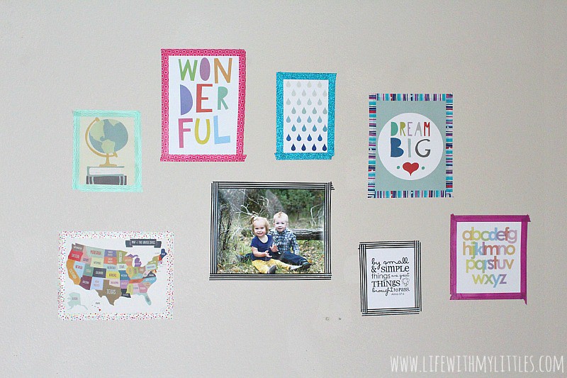 Love this renter-friendly gallery wall! What a cute way to hang up pictures without making holes in the walls! And it's so bright and colorful!
