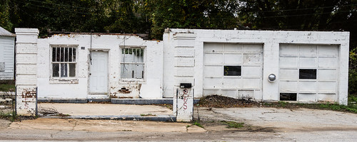 Decaying old service station building