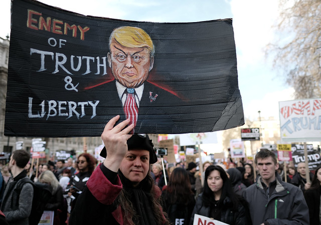 Enemy of truth and liberty - protester in Whitehall during the anti-Trump ban march in London.