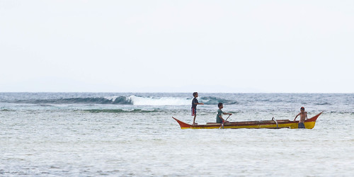 ocean people seascape beach children boat seaside surf waves play pacific outdoor philippines canoe shore vehicle banka surigaodelsur panaraga