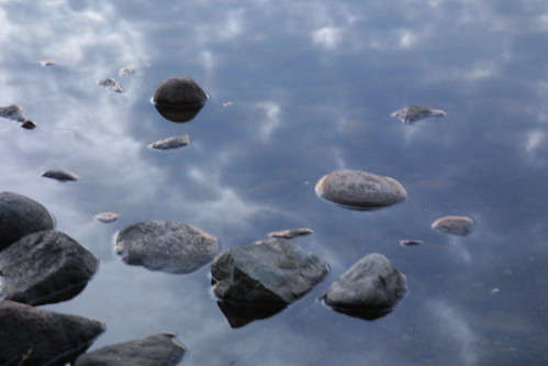 bear sky lake reflection water wisconsin clouds landscape rocks